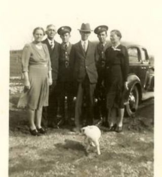 The only known photo of Tip with my dad's aunt and uncle Mary and Fred White, an unidentified soldier, my grandparents Bob and Hattie White with Tom White in uniform. 